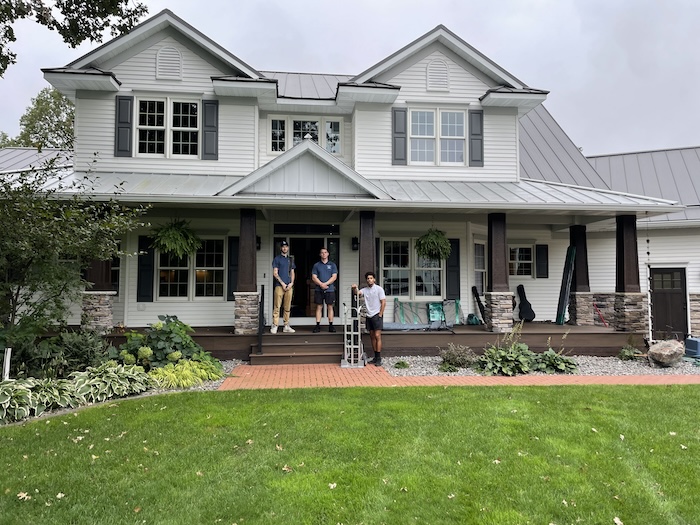 Pretty Strong Movers in front of house