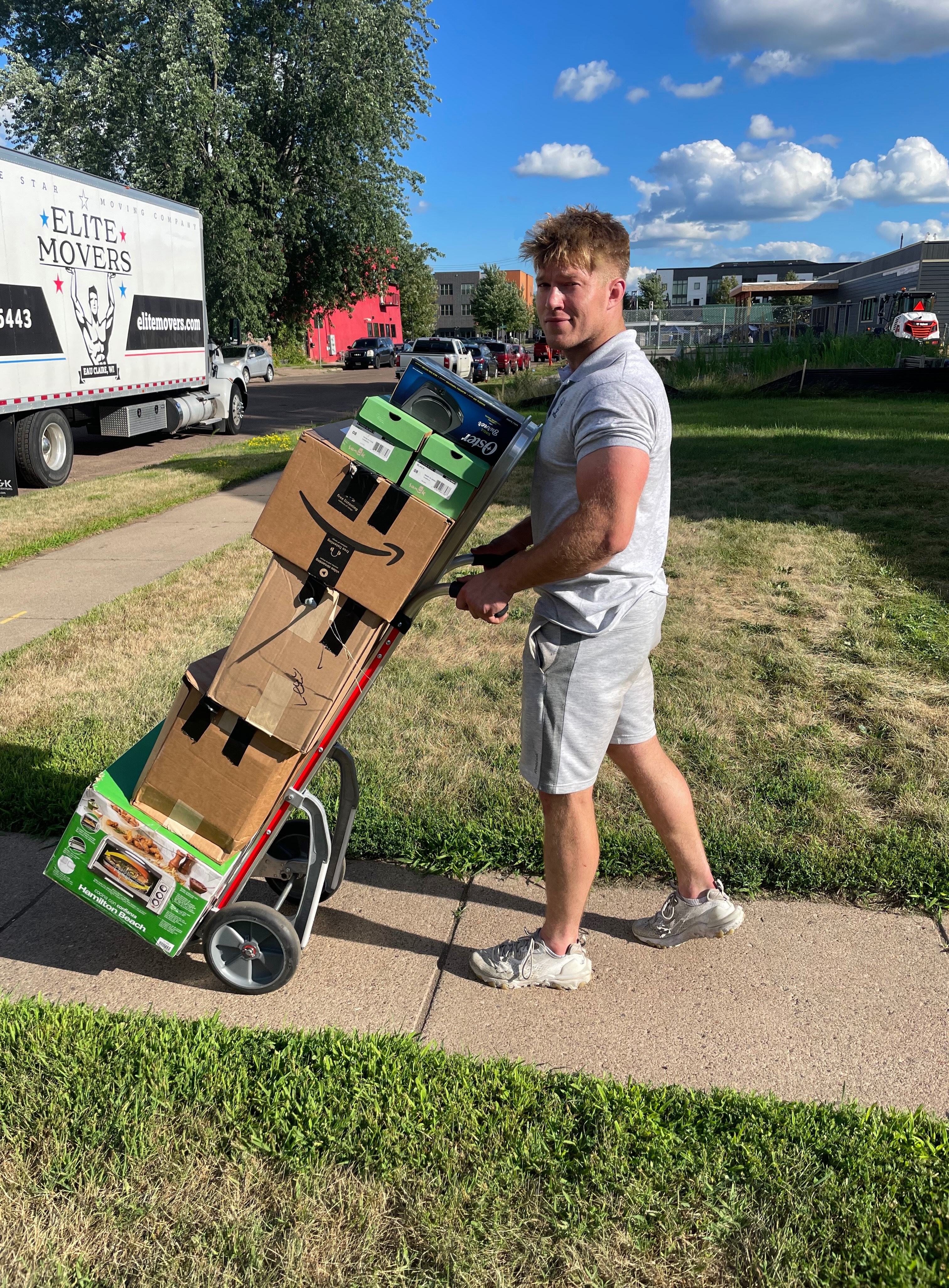 Owner Wyatt Schauf moving a dresser